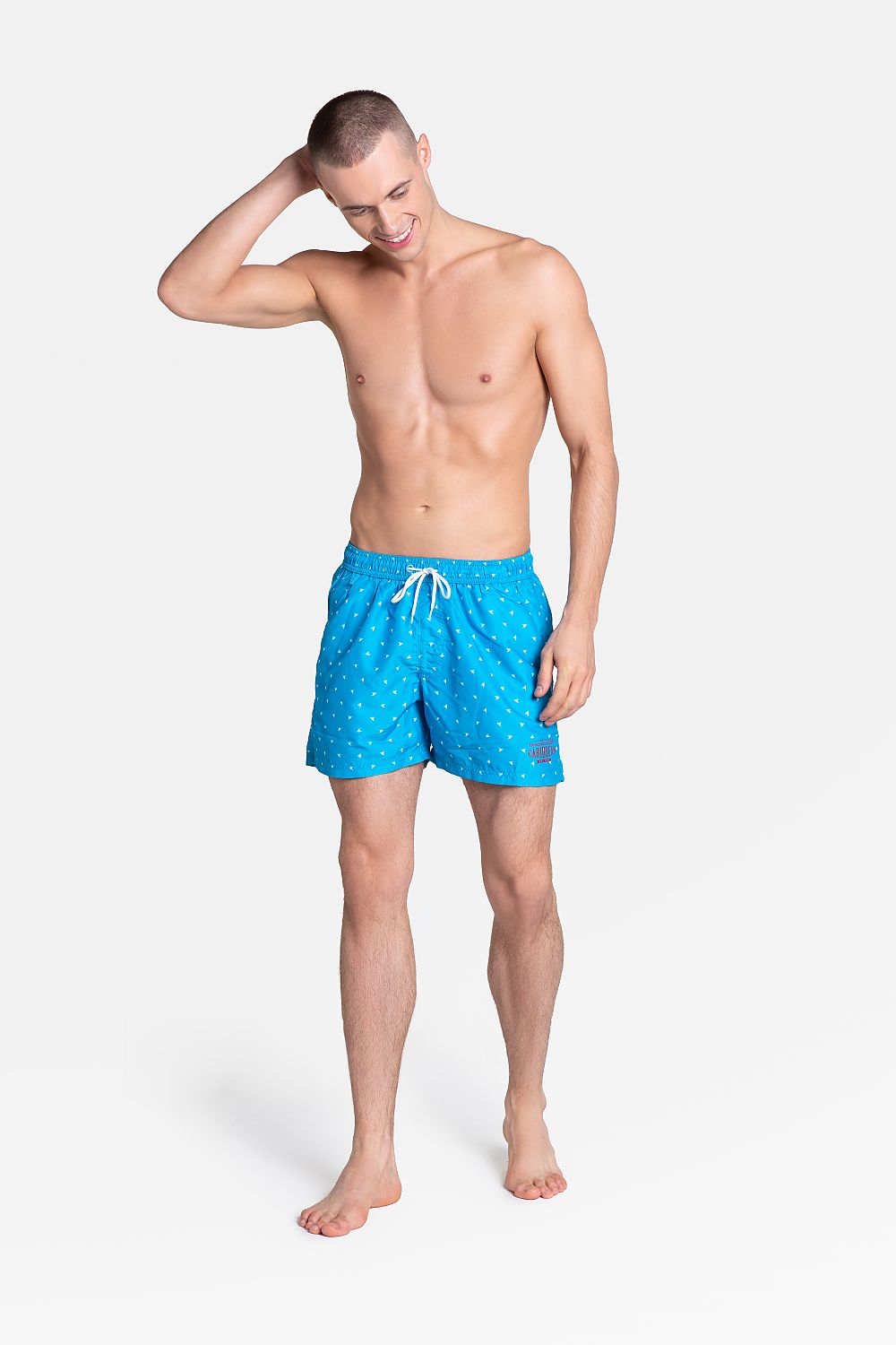 Elevate your summer style with Henderson 2021 Swim Shorts, featuring a vibrant blue colour and a comfortable loose-fit design. Perfect for beach outings, these swim trunks showcase a quick-drying fabric and a stylish tiny pattern, ideal for sophisticated aquatic adventures.