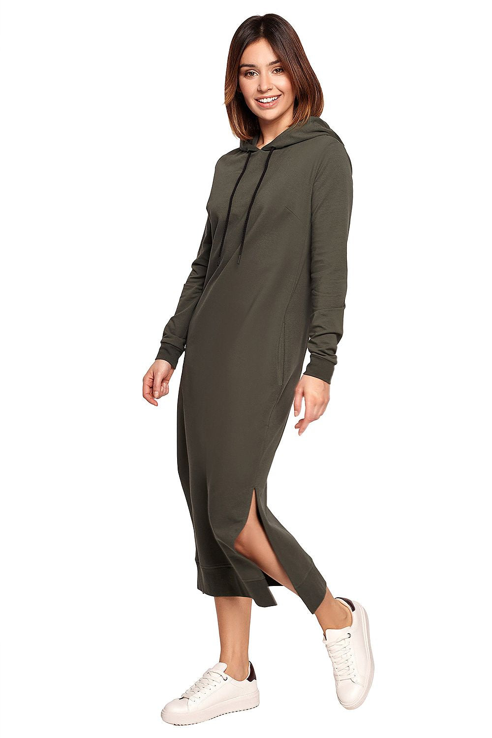 Chic model showcasing the BeWear Cotton Spandex Daydress in olive green, complete with a hood, side slits, and ribbed trims for a timeless look.