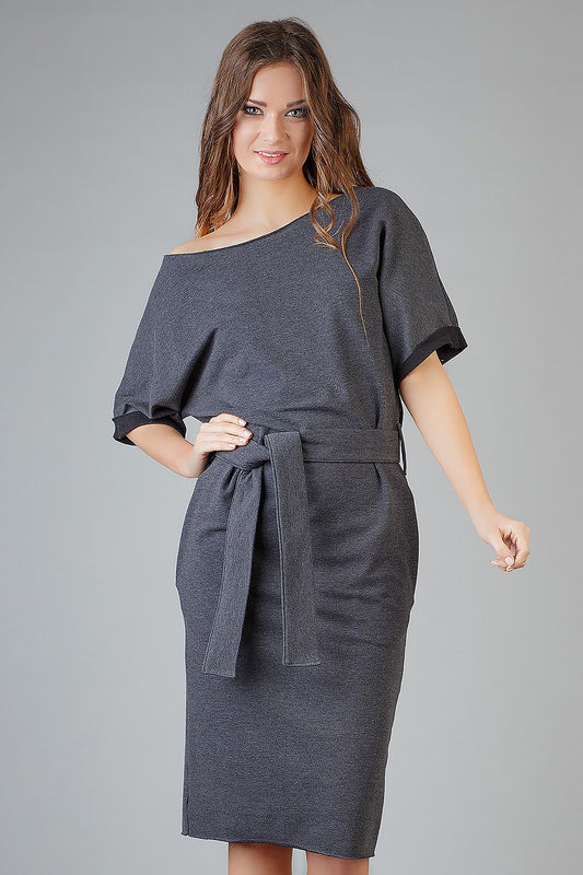 Luxurious Tessita Daydress showcasing an elegant loose-fitting kimono design with decorative cuffs and pockets, perfect for sophisticated summer styles.