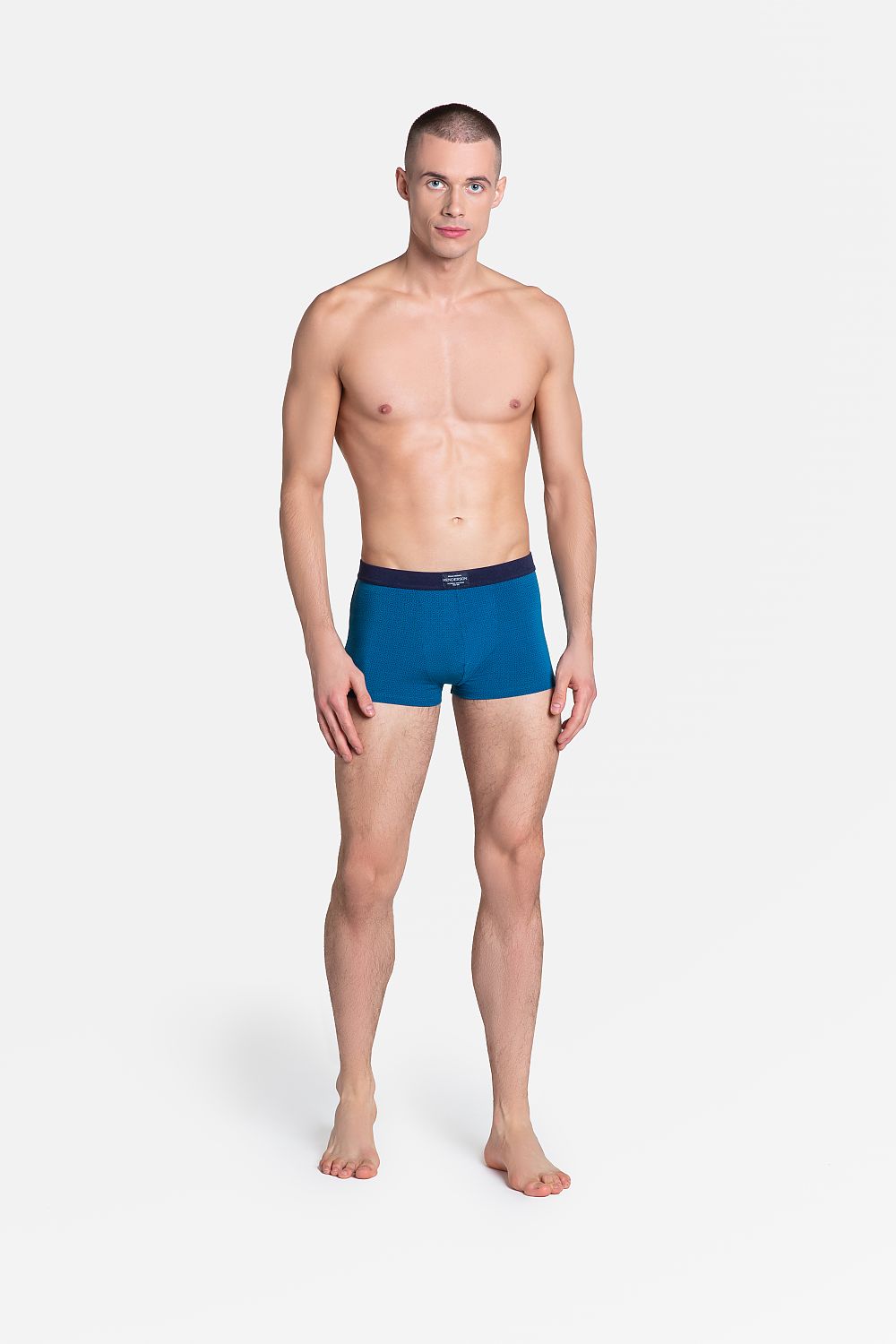 Henderson Premium Men's Boxers in a refined turquoise shade showcased on a model, exuding luxury and comfort in a cotton, viscose, and spandex blend.