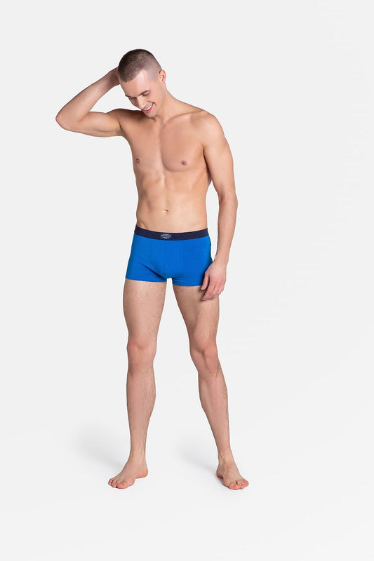 Henderson Premium Men's Boxers in a stylish blue tone featured on a model, epitomizing elegance and comfort with a cotton, viscose, and spandex blend.