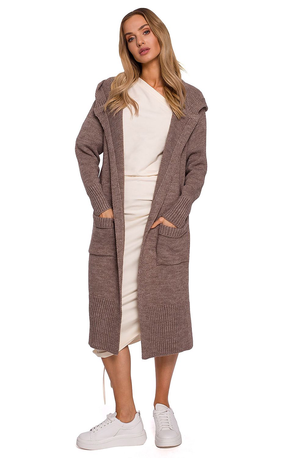 Luxurious long cardigan by Moe featuring a fitted hood, two large front pockets, and stylish side slits, modelled in a soft taupe colour.