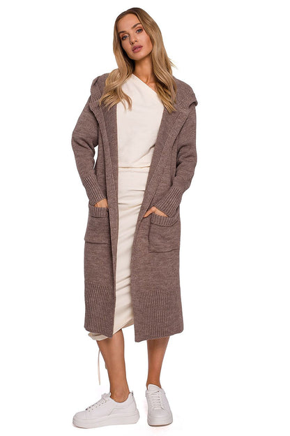 Luxurious long cardigan by Moe featuring a fitted hood, two large front pockets, and stylish side slits, modelled in a soft taupe colour.