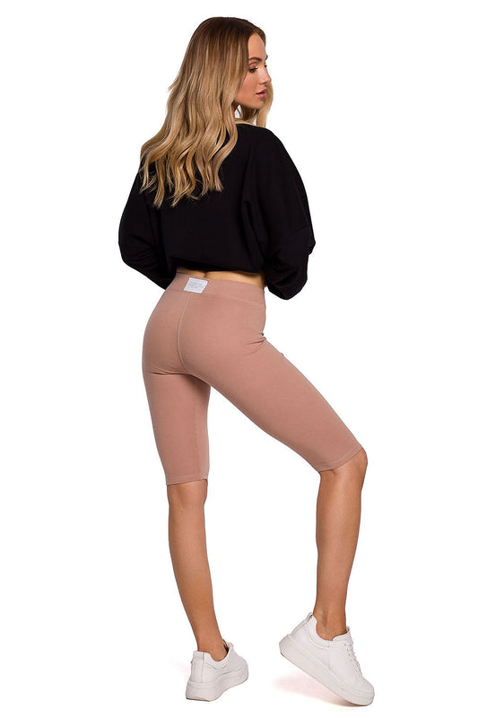 Elegant rear view of a model in Moe Short Leggings for Sports, showcasing the soft cotton blend fabric and comfortable elastic waist, perfect for any athletic activity.