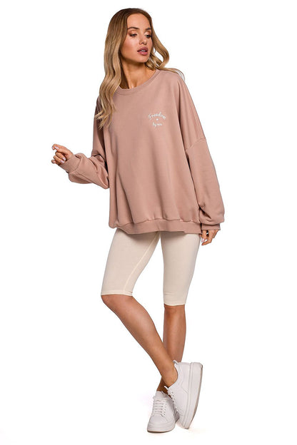 Chic front view of a model in Moe Short Leggings for Sports, paired with a trendy oversized jumper, exemplifying comfort and fashionable athletic wear.