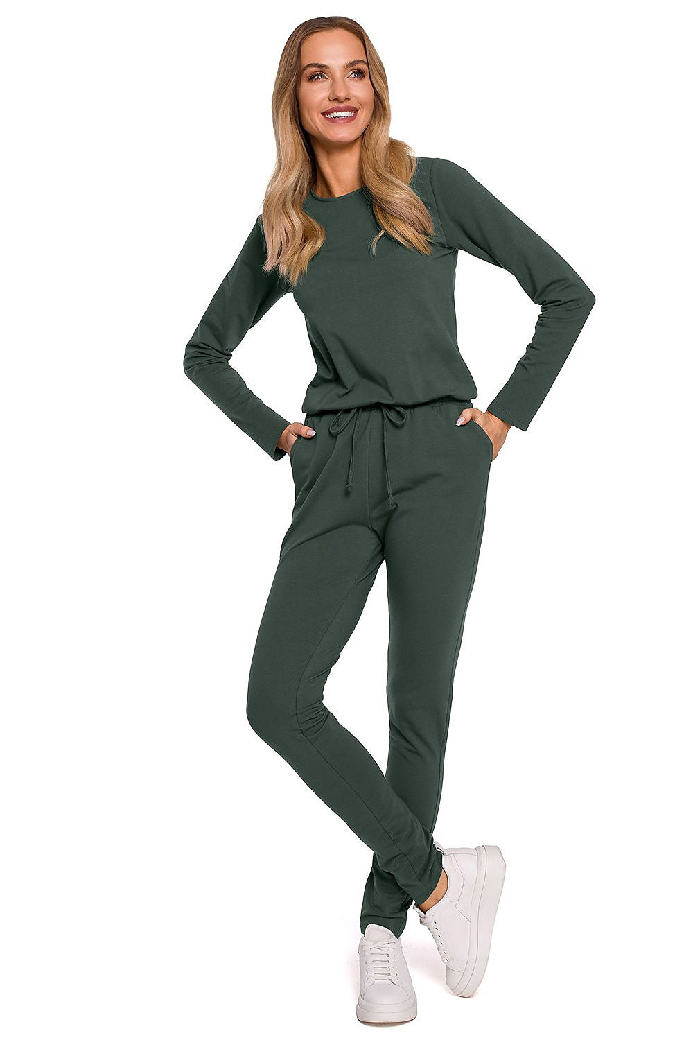 Chic green variant of the Elegant Women's Fitted One-Piece Jumpsuit By Moe, designed with long sleeves, an adjustable waistband, and multiple pockets, epitomising contemporary luxury.