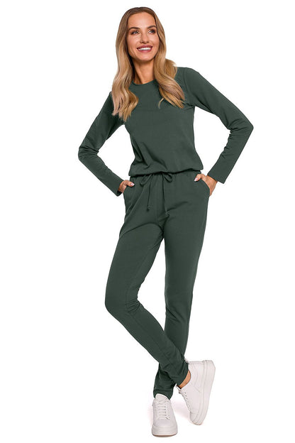 Chic green variant of the Elegant Women's Fitted One-Piece Jumpsuit By Moe, designed with long sleeves, an adjustable waistband, and multiple pockets, epitomising contemporary luxury.