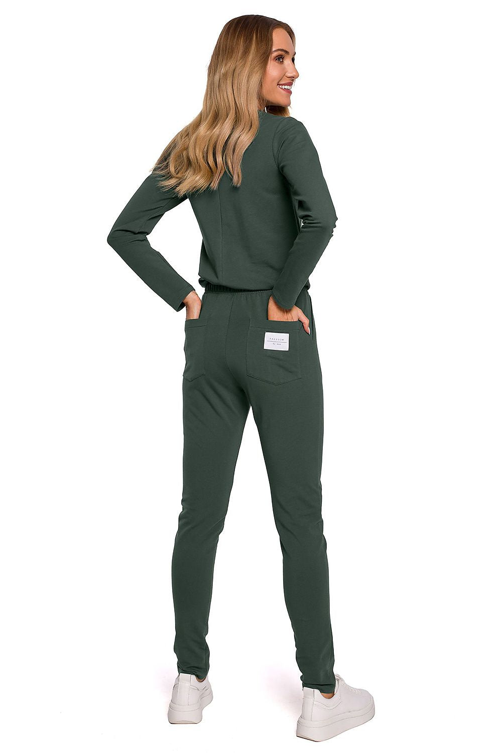 Elegant women's fitted one-piece jumpsuit with adjustable waistband and multiple pockets by Moe, showcased from the back in deep green colour, perfect for a chic casual look.