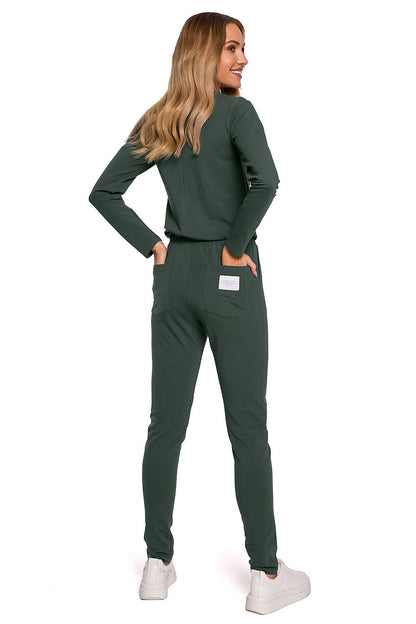 Elegant women's fitted one-piece jumpsuit with adjustable waistband and multiple pockets by Moe, showcased from the back in deep green colour, perfect for a chic casual look.