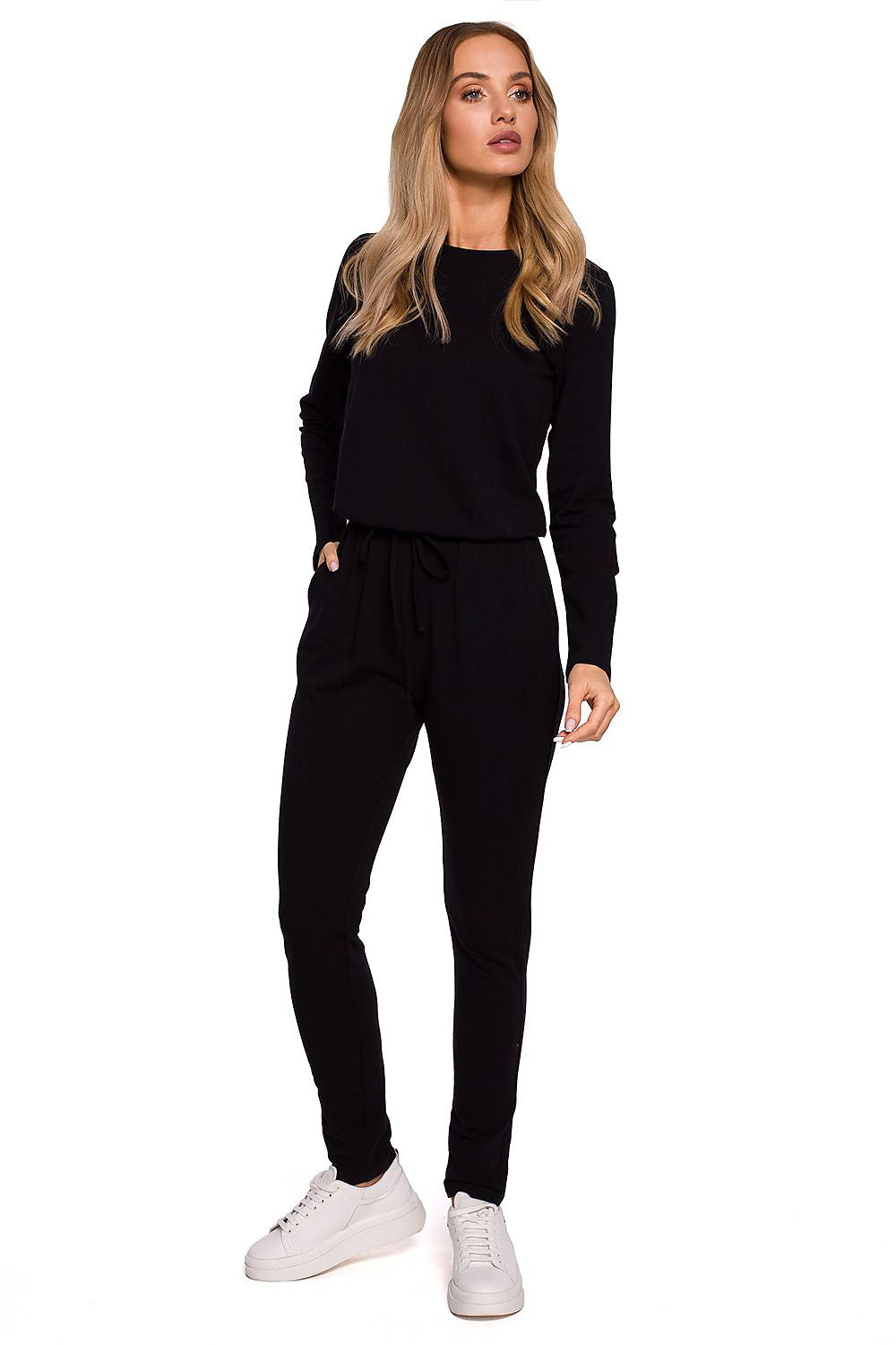 Elegant women's fitted one-piece jumpsuit with adjustable waistband and multiple pockets by Moe, modelled in a classic black colour, exuding elegance and versatility for any occasion.