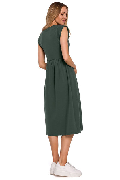 Moe Midi Length Knitted Dress With High Waist Cut And Loose Skirt, demonstrating an elegant back view in a beautiful green colour, suitable for various occasions.