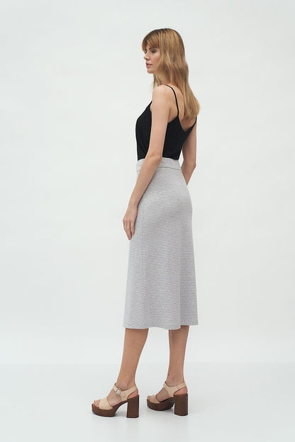 Luxury Midi Skirt by Nife shown from a side perspective, accentuating the flared silhouette and stylish knitwear texture.