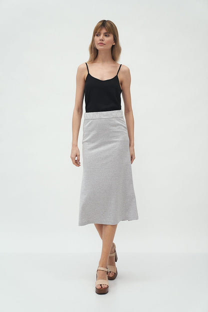Luxury Midi Skirt by Nife on a model, presenting the timeless flared silhouette in textured knitwear, ideal for effortless spring elegance.