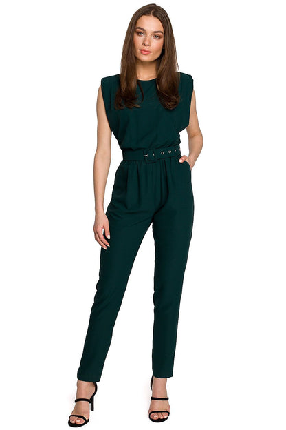 Stylish Suit Stylove featuring a sleeveless design with shoulder pads, a belt, and tapered trousers, embodying luxury and elegance.