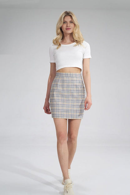 Sophisticated front view of the Short skirt by Figl, highlighting the tailored fit and fashionable plaid design worn with a cropped white tee.