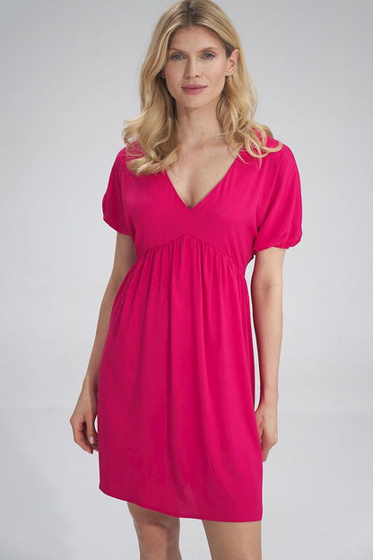 Sophisticated pink Daydress Figl highlighting a versatile and elegant style with a soft V-neck and pleat detailing, perfect for a lavish occasion.