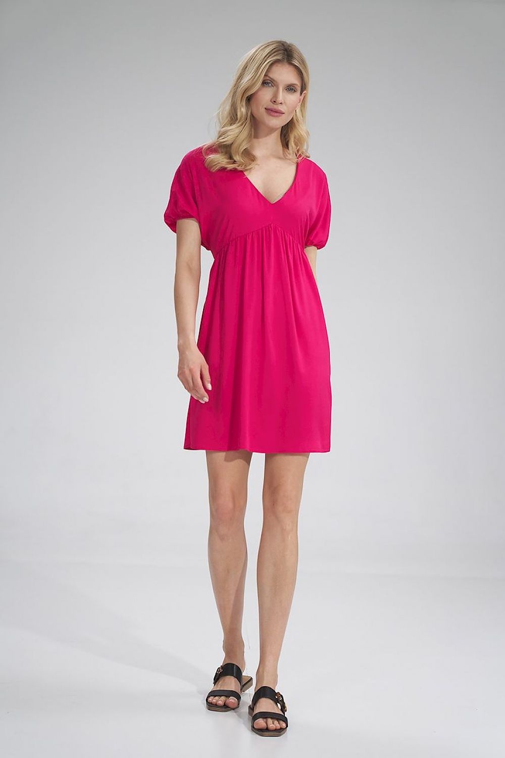 Elegant loose-fitting Daydress by Figl, featuring a vibrant pink hue, sweetheart neckline, and short buffet sleeves, perfect for casual summer outings.