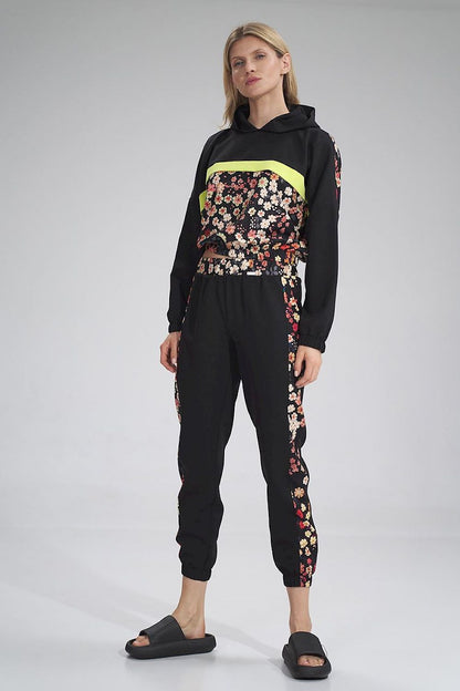 Trendy Figl tracksuit trousers in a vibrant floral pattern, perfect for making a fashion statement while enjoying casual wear with a luxurious touch.