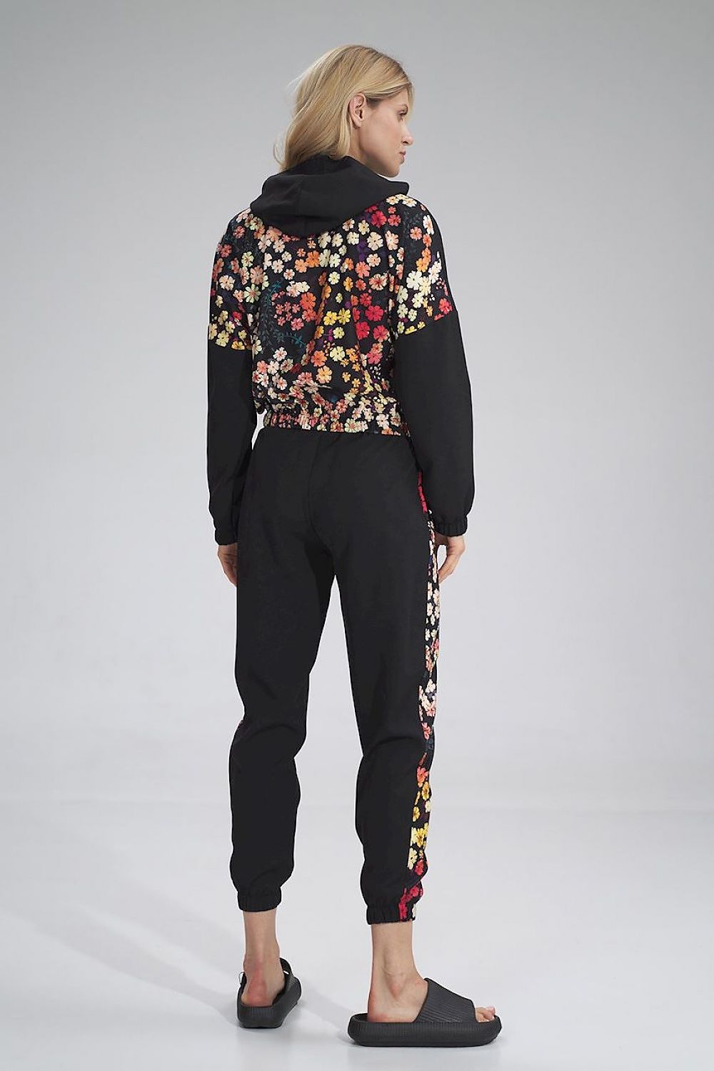 Elegant Figl tracksuit trousers from the back, featuring a unique floral design and comfortable waistband, embodying luxury and style in activewear.