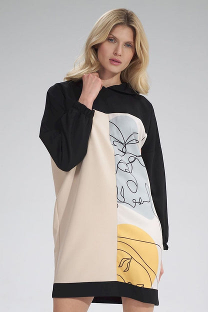 Elegant Daydress Figl featuring a chic three-coloured design with a hood, showcased by a model exuding luxury and style.