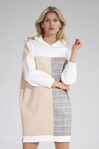 Chic Daydress Figl with a stylish hood and plaid detail, modeled elegantly to reflect modern luxury for the discerning woman.