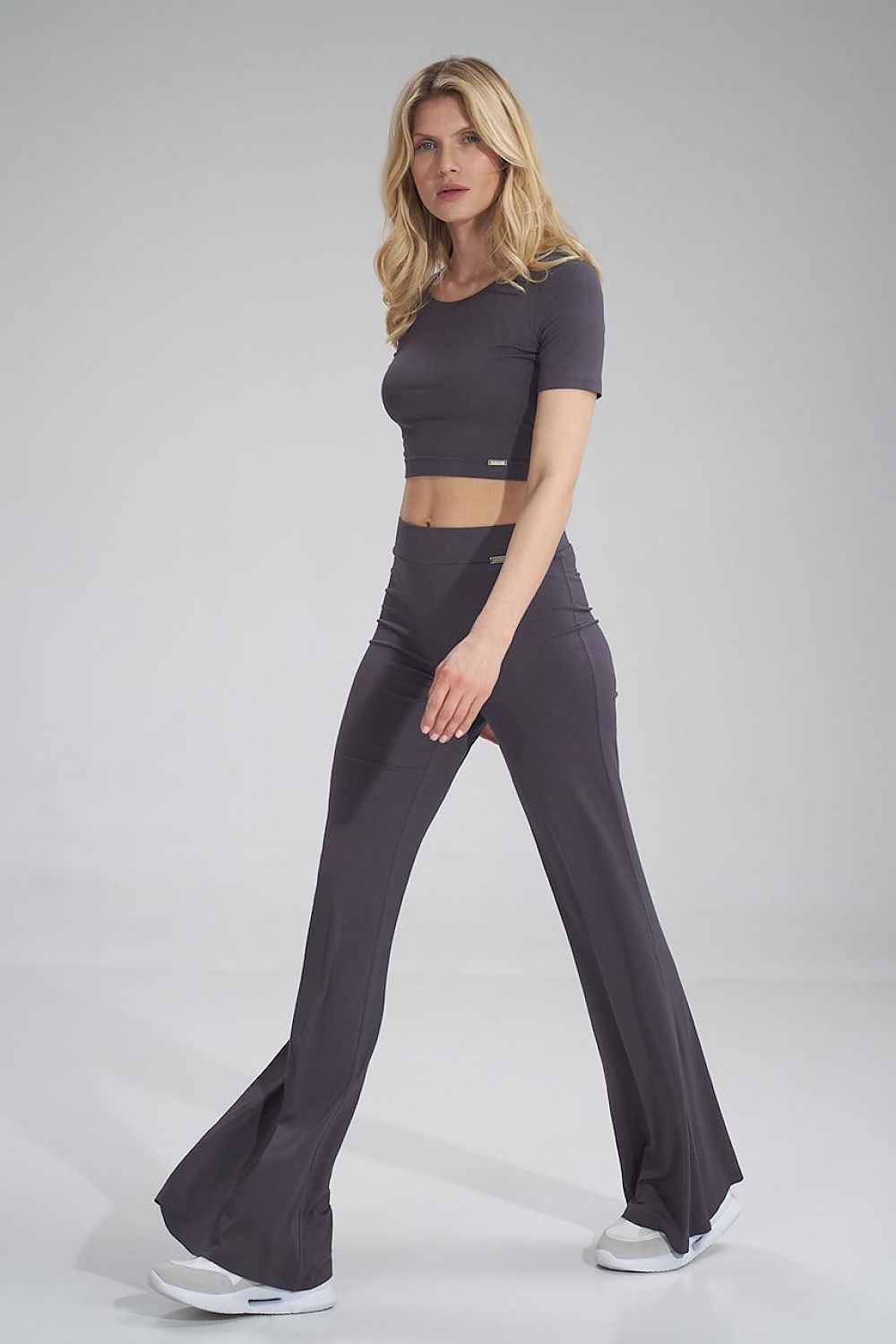 Stylish Figl cropped blouse paired with form-flattering trousers, highlighting a contemporary look for elegant occasions.