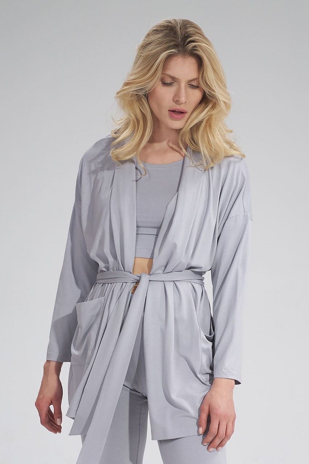 Elegant loose-fitting grey sweatshirt by Figl, designed with an unbuttoned style and a belt, featuring large front pockets. Perfect for effortless luxury attire.