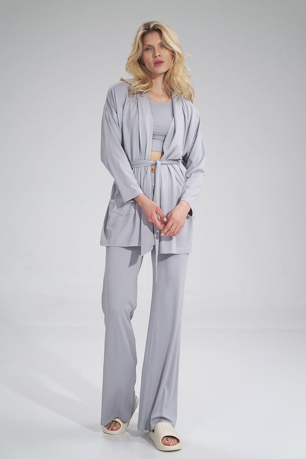Front view of a luxury grey sweatshirt from Figl, featuring a loose-fitting design, unbuttoned jacket style with a belt, and large front pockets.