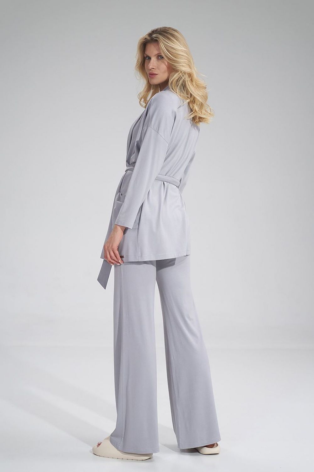 Back view of a premium Figl sweatshirt in grey, showcasing a sophisticated loose design with belted waist and elegant draping.