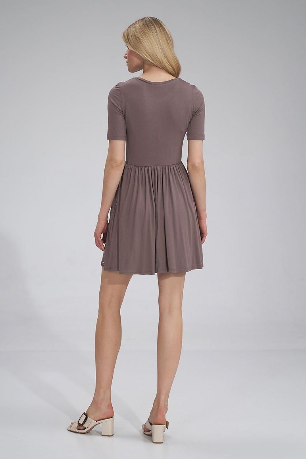 Back view of the luxurious Figl summer sports dress, showcasing the gathered waist, short sleeves, and flared design in a chic brown hue.