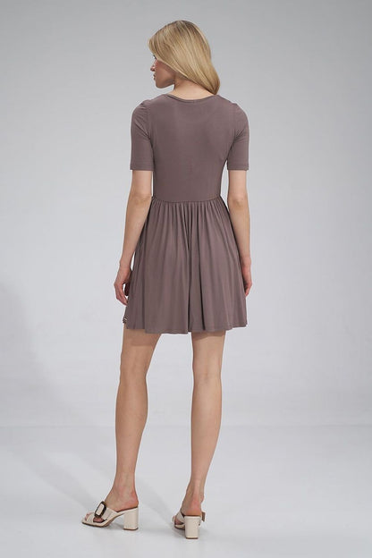 Back view of the luxurious Figl summer sports dress, showcasing the gathered waist, short sleeves, and flared design in a chic brown hue.