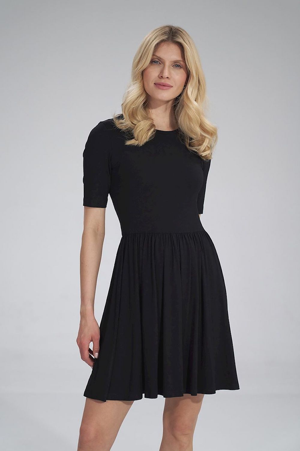 Elegant black summer sports dress with short sleeves, gathered waist, and a flared skirt by Figl, showcasing modern style and comfort.