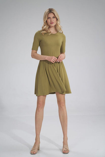 Elegant Daydress Figl featuring a summer style, short sleeves, gathered waist with an elastic band, and a slightly flared hem, showcased on a model in an olive hue. Perfect for chic summer outings.