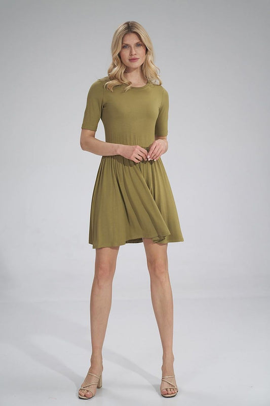 Elegant Daydress Figl featuring a summer style, short sleeves, gathered waist with an elastic band, and a slightly flared hem, showcased on a model in an olive hue. Perfect for chic summer outings.