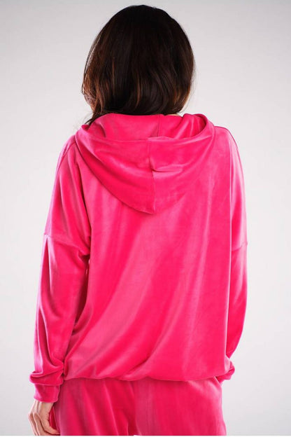Back view of a sumptuous pink velour sweatshirt by Awama, highlighting the stylish hood and soft fabric, ideal for a fashion-forward wardrobe.