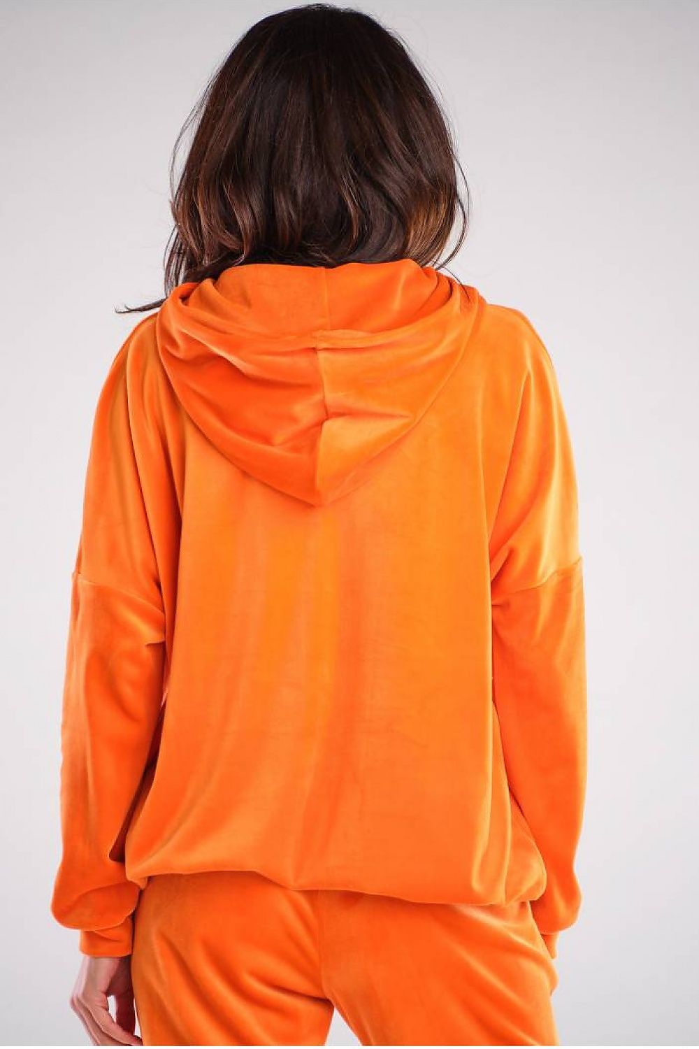 Back view of the exquisite orange velour sweatshirt by Awama, highlighting the chic hood design and soft fabric ideal for a fashionable casual outfit.
