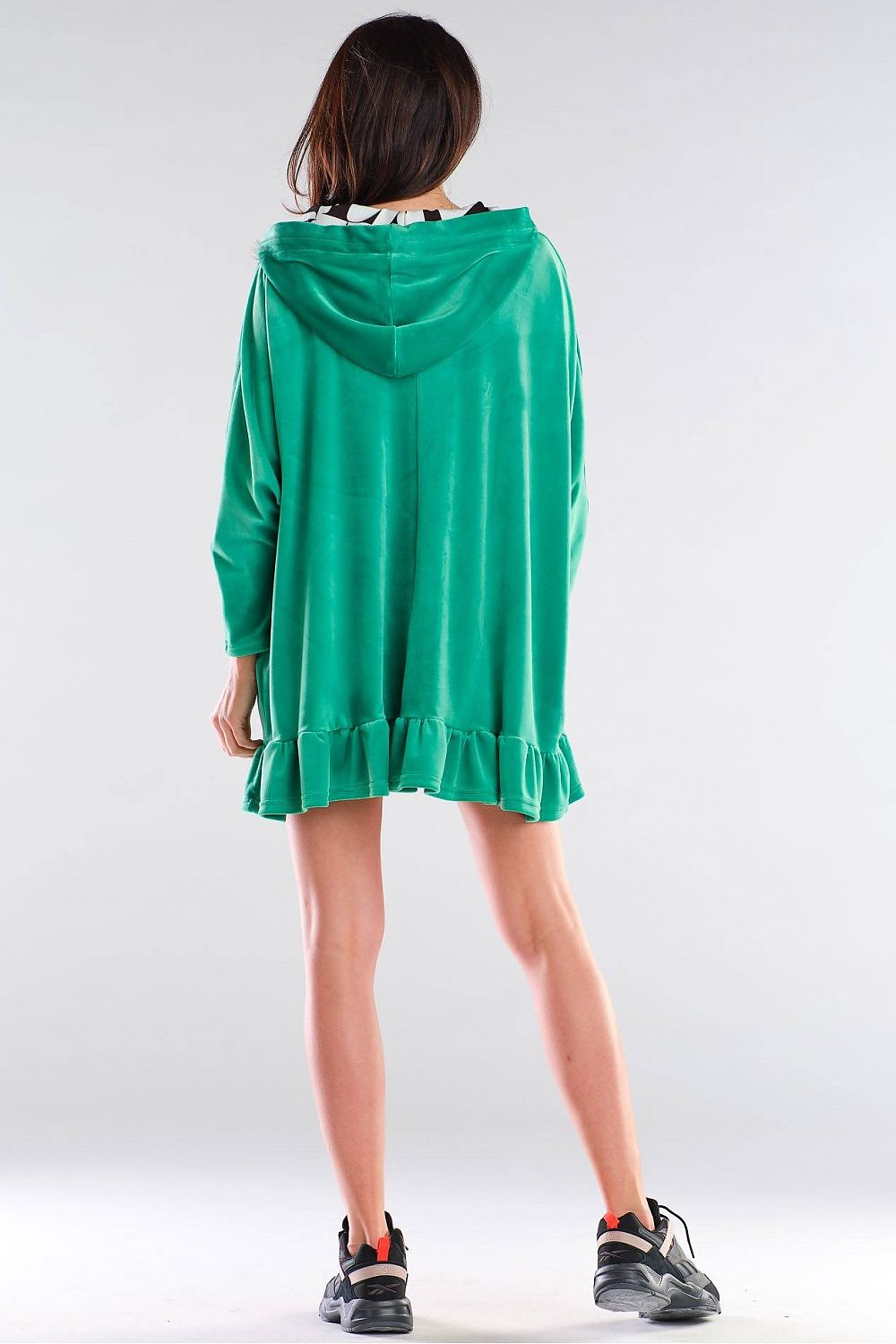 Elegant oversized cut sweatshirt dress by Awama in vibrant green, featuring a stylish frill at the bottom and a hood, perfect for a chic, casual look.