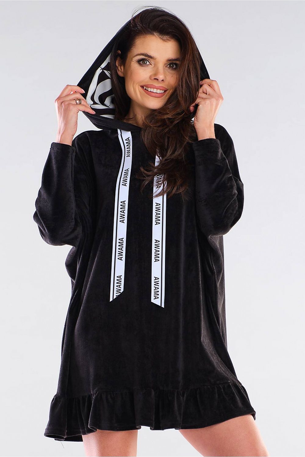 Elegant black daydress by Awama featuring an oversized cut and a stylish hood, enhanced with logoed drawstrings and a charming frill at the hem.
