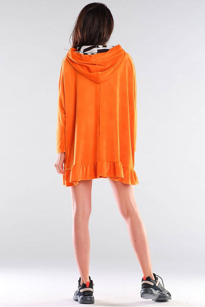 Elegant oversized cut Daydress by Awama featuring a chic hood, flowing design, and stylish frill at the bottom in vibrant orange, ideal for a luxurious casual look.