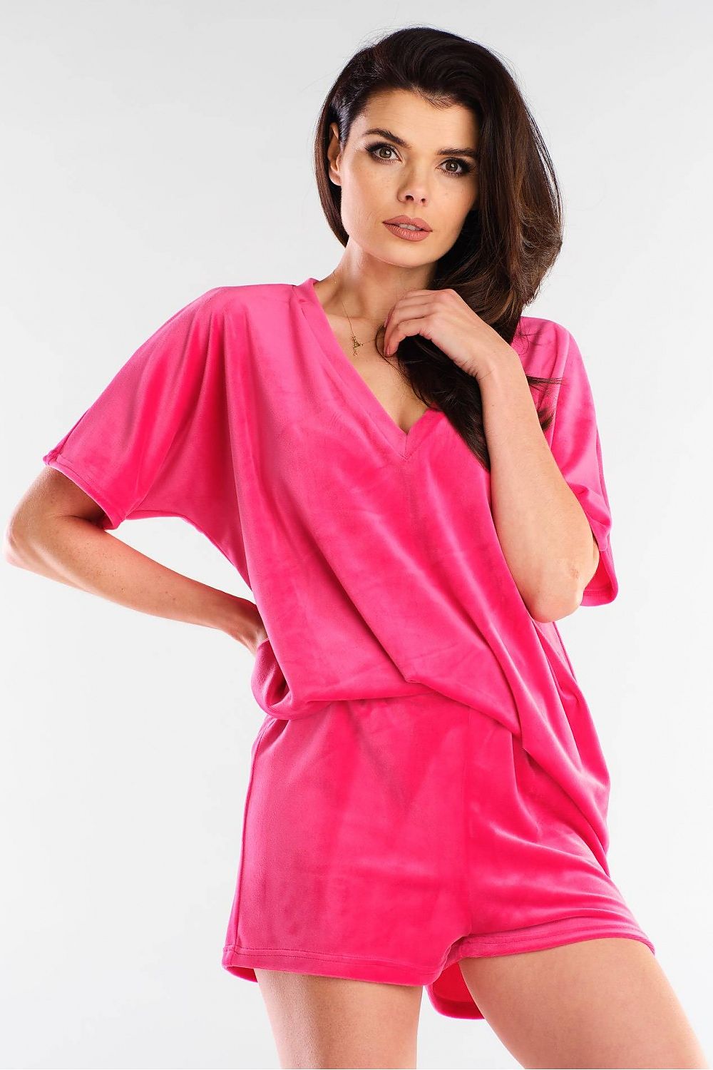 Elegant pink velour shorts by Awama, paired with a matching loose-fitting top, exemplifying luxury and comfort. Perfect for stylish casual wear.