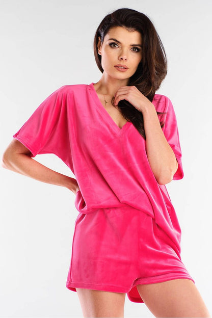 Elegant pink velour shorts by Awama, paired with a matching loose-fitting top, exemplifying luxury and comfort. Perfect for stylish casual wear.