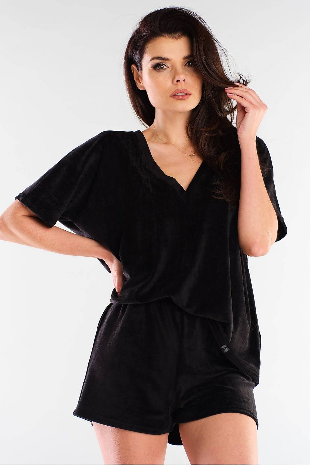 Sophisticated black velour shorts by awama, featuring a loose-fitting style paired with a matching v-neck top, designed for stylish comfort.
