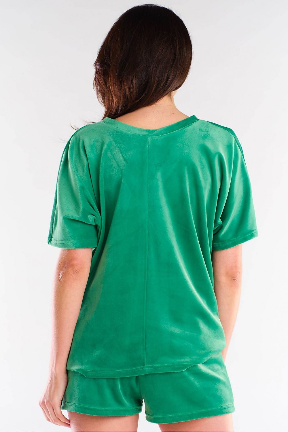 Stylish back view of the luxury Awama green shorts set, showcasing the soft velour fabric and relaxed fit, perfect for a chic casual look.