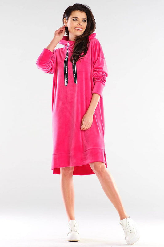 Elegant Daydress by Awama in sumptuous pink velour, highlighting a relaxed fit and chic hoodie style, ideal for sporty yet fashionable spring wear.