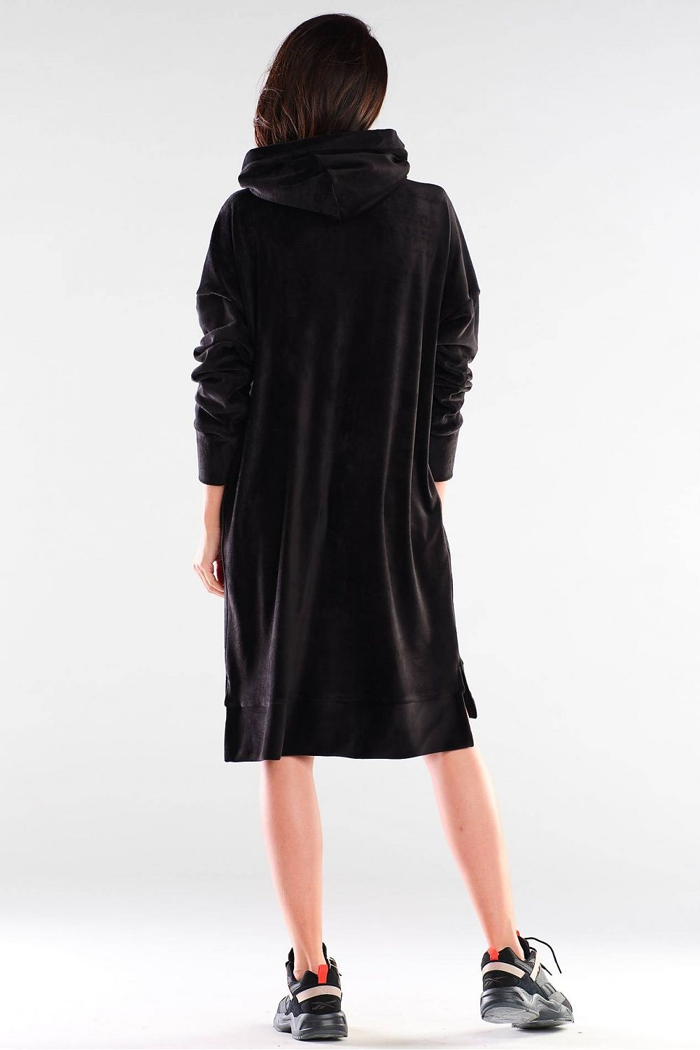 Back view of a luxurious black daydress by Awama, showcasing its elegant velour fabric and modern hoodie design.
