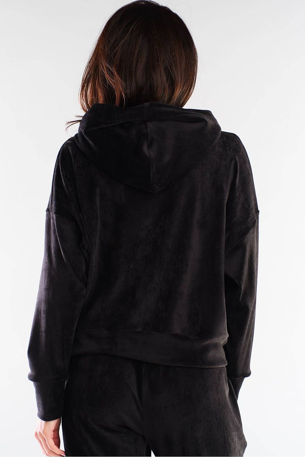 Back view of a stylish black velour hooded sweatshirt by Awama, demonstrating its high-quality fabric and chic design.