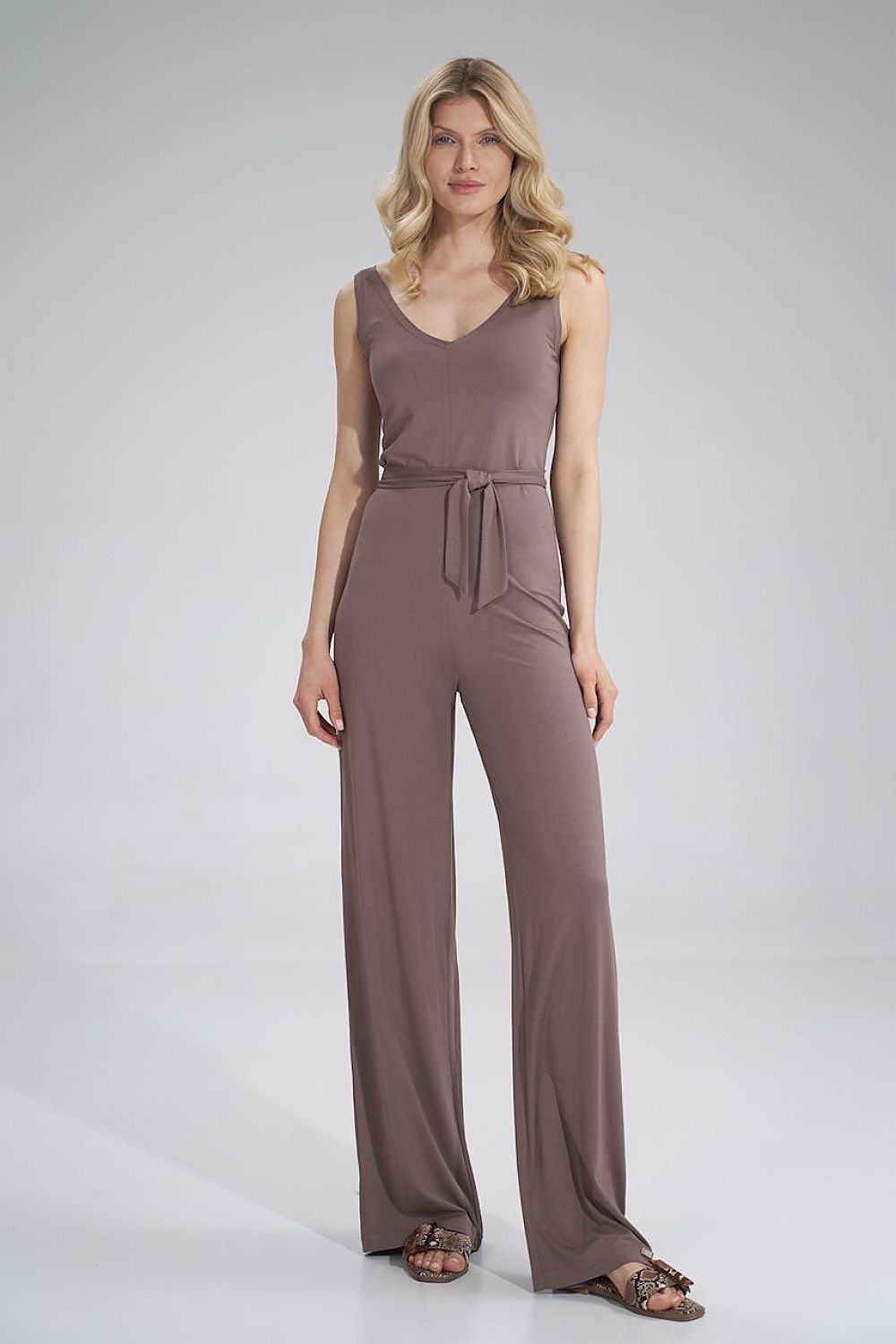 Stylish Figl sleeveless jumpsuit in a rich brown hue, featuring a sweetheart neckline and a tied waist, designed for a flattering fit with wide legs.