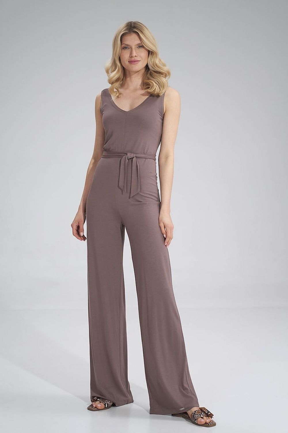 Sophisticated front view of a Figl brown sleeveless jumpsuit, accentuated by a belted waist and flowing wide legs, perfect for summer chic.