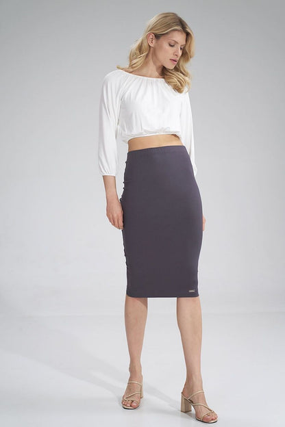 Stylish 3/4 sleeve pleated blouse from Figl, featuring a graceful woman in a chic ensemble, accentuating its modern design and perfect fit.