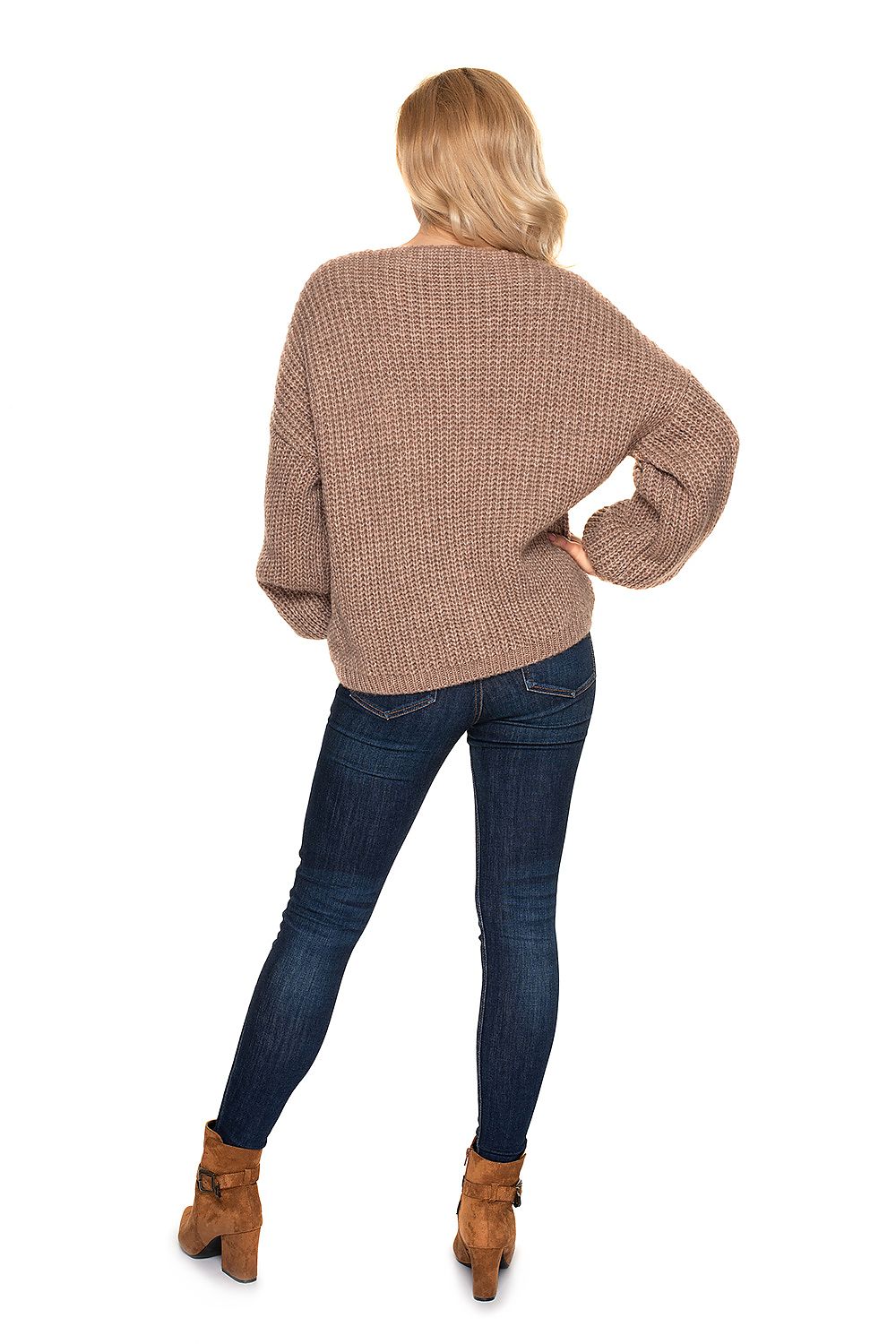 PeeKaBoo Oversized Cardigan Sweater with Wooden Buttons, Cozy Knit, Elegant Style - Rear view of a model showcasing the beige oversized cardigan sweater, complemented by denim jeans and stylish ankle boots.